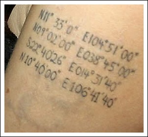 Actor Angelina Jolie's left bicep tattoo of the latitude and longitude of the birthplaces of her four children: Closeup