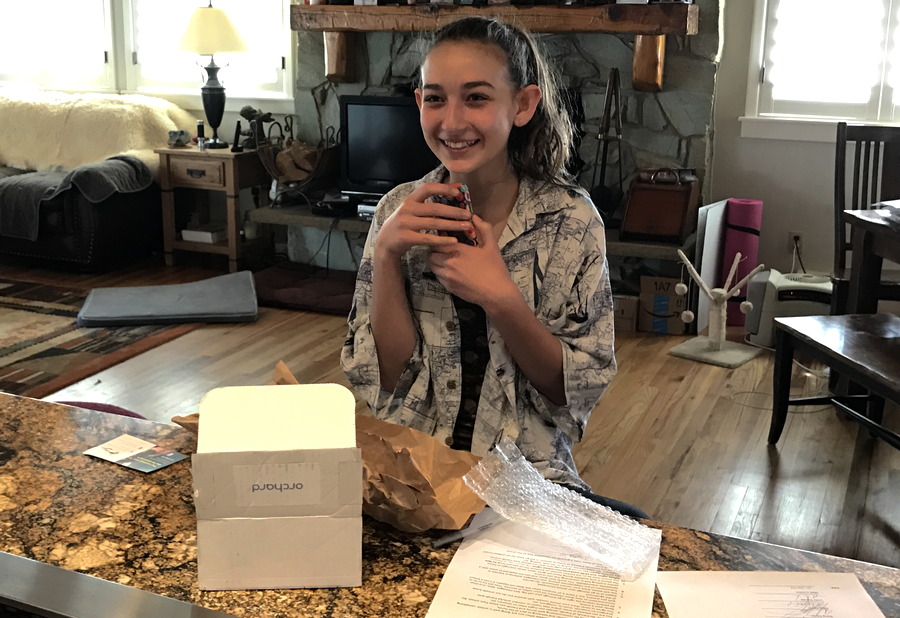 teen girl with her first cellphone smartphone iphone