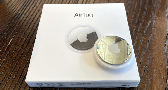 apple airtag on top of box